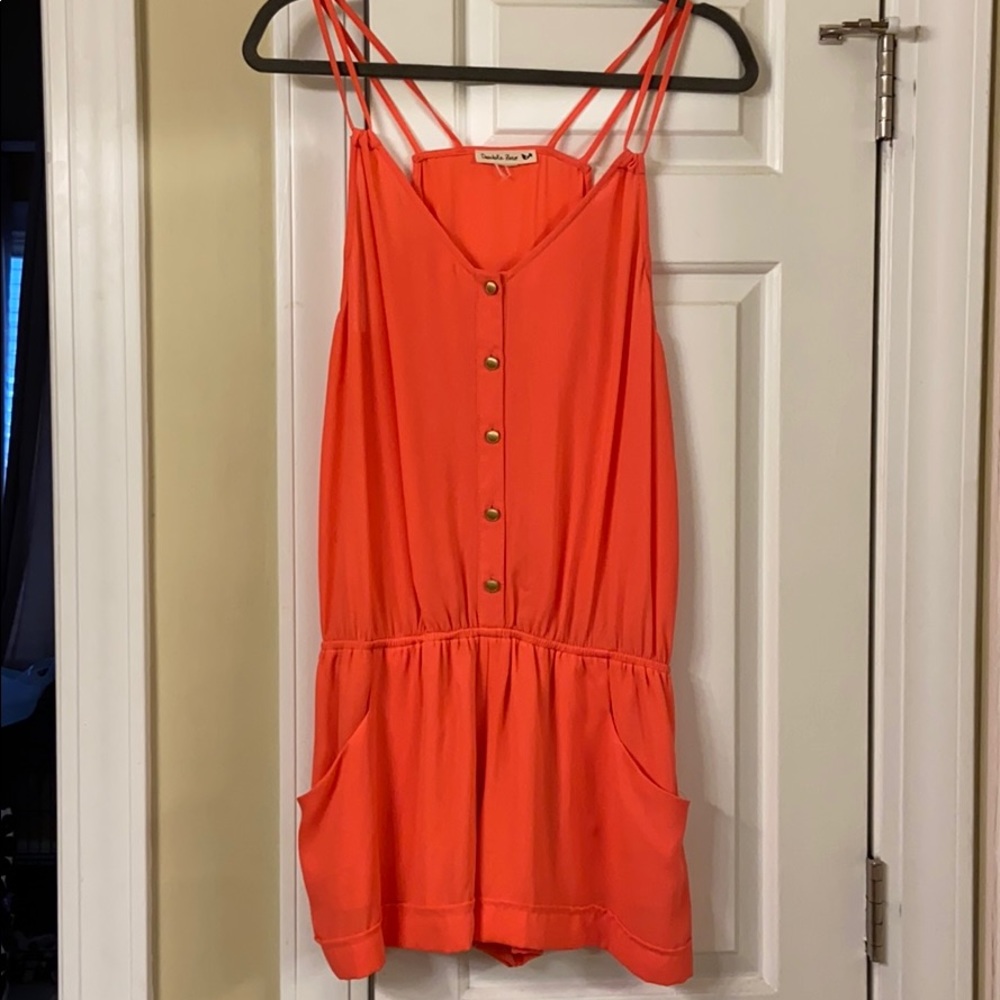 Pink romper with with pockets